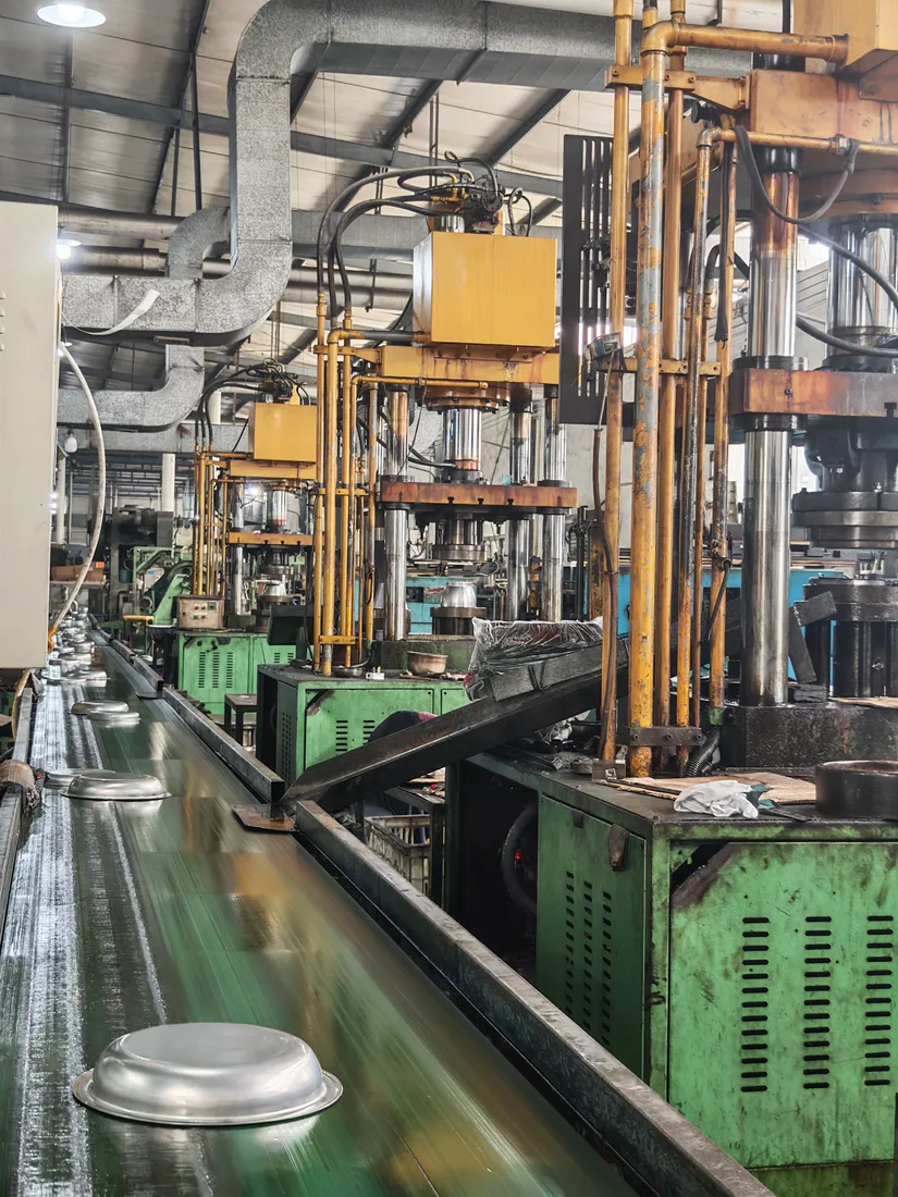 Presses forming stainless steel parts in the press shop